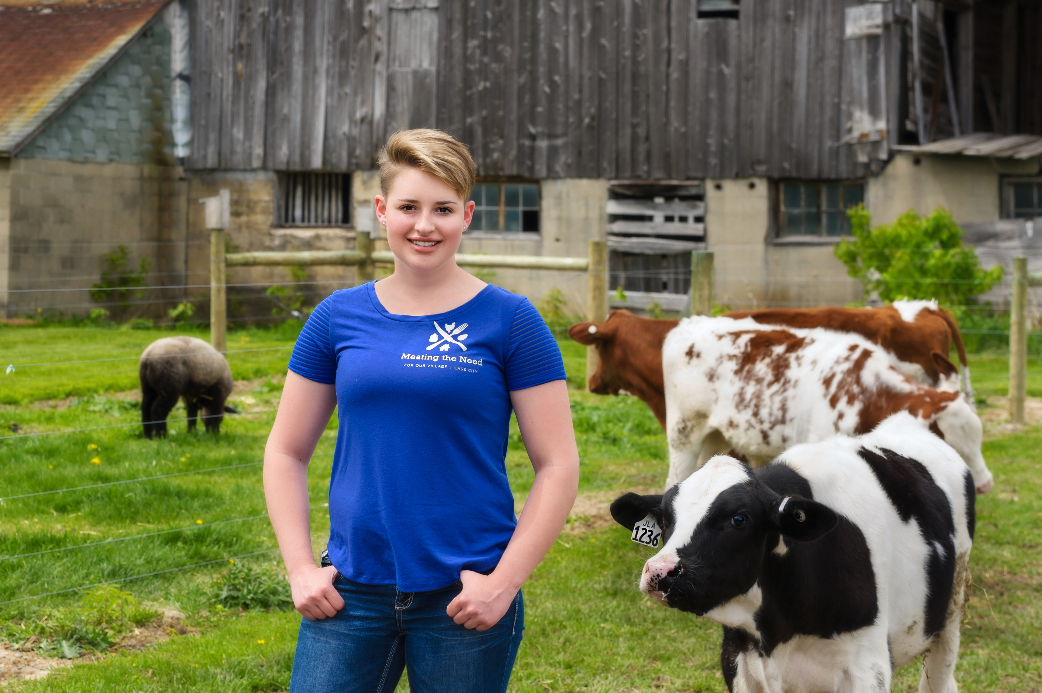 Addy in front of a barn